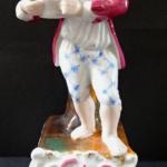 Barefoot boy with a bowl on a pedestal Barefoot boy with a bowl on a pedestal