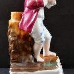 Barefoot boy with a bowl on a pedestal Barefoot boy with a bowl on a pedestal